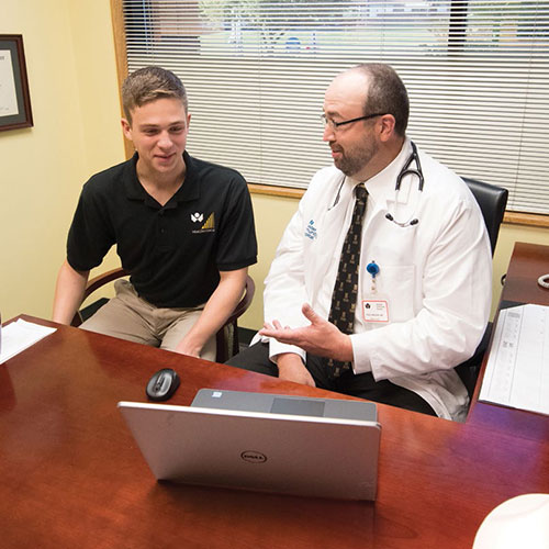 Scott Perkins ’20 collaborated with Dr. Paul Nielsen ’95 (pictured) and Dr. Amy Jolliff, co-medical directors of the ۿ۴ý Community Care Network, and Alex Davis, director, to evaluate the outcomes of the Health Coach program.
