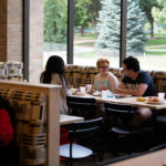 Students eat and socialize in the newly renovated dining area of the Lowry Center at The College of ۿ۴ý.