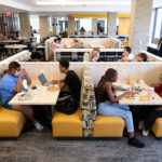 Students eat and socialize in the newly renovated dining area of the Lowry Center at The College of ۿ۴ý.