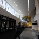 A student in the atrium of the newly-renovated Lowry Center at The College of ۿ۴ý.